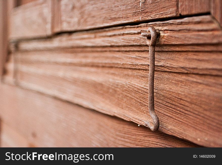 Wooden frame with old rusted latch. Wooden frame with old rusted latch