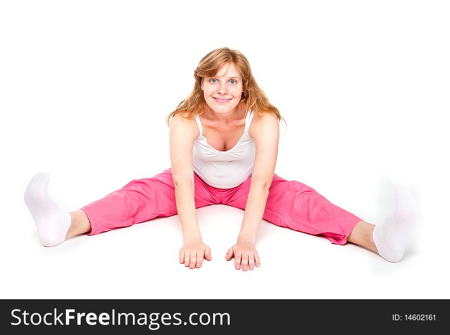 Pregnant woman making fitness exercises isolated over white