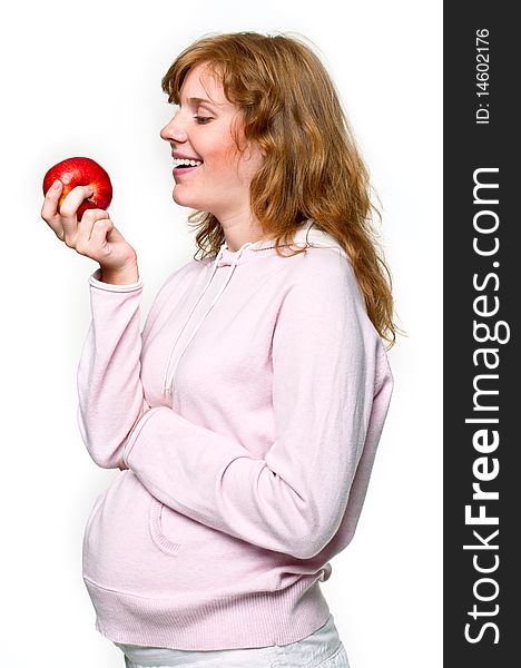 Pregnant woman with apple