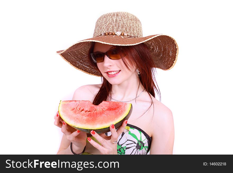 A beautiful woman wearing a hat and sunglasses, enjoying a sweet watermelon. A beautiful woman wearing a hat and sunglasses, enjoying a sweet watermelon.