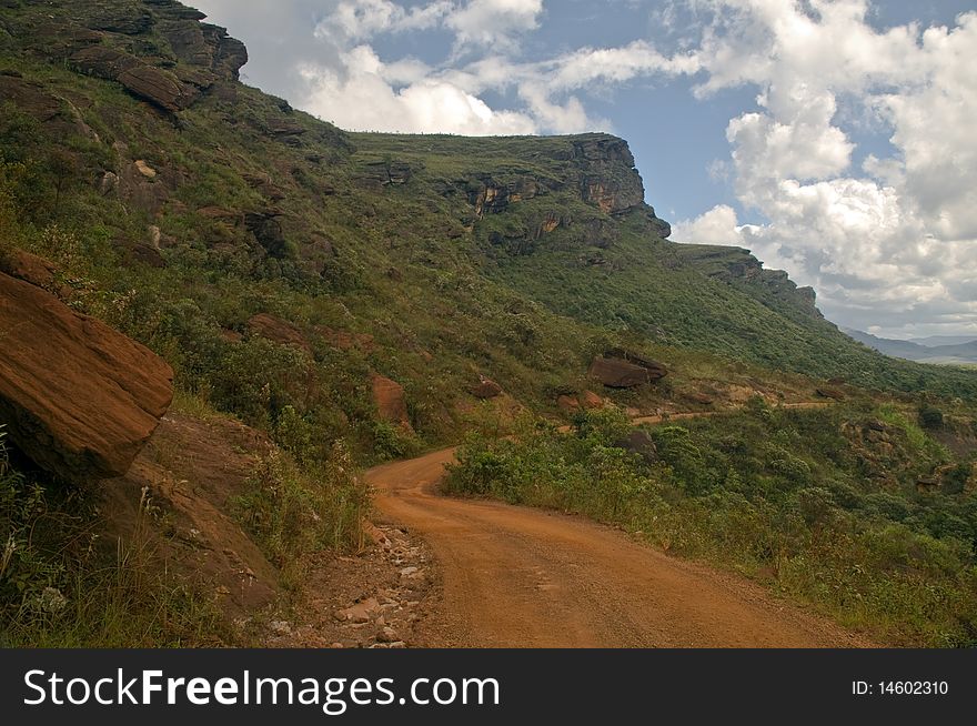 Dusty Road in a mountain landscape.