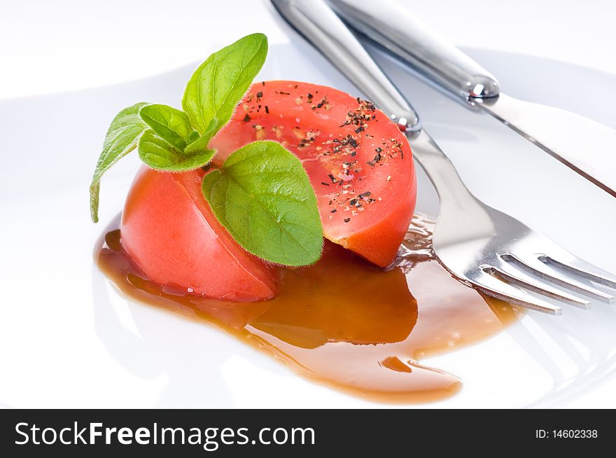 Salad of tomato, fresh basil and balsamic vinegar. Salad of tomato, fresh basil and balsamic vinegar.