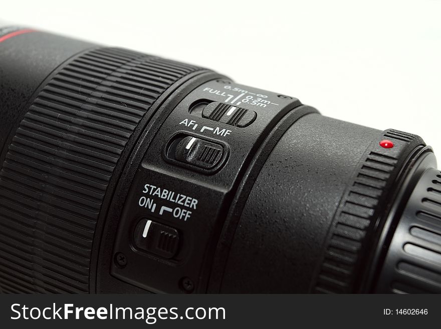 A professional 100mm macro lens isolated on a white background. A professional 100mm macro lens isolated on a white background