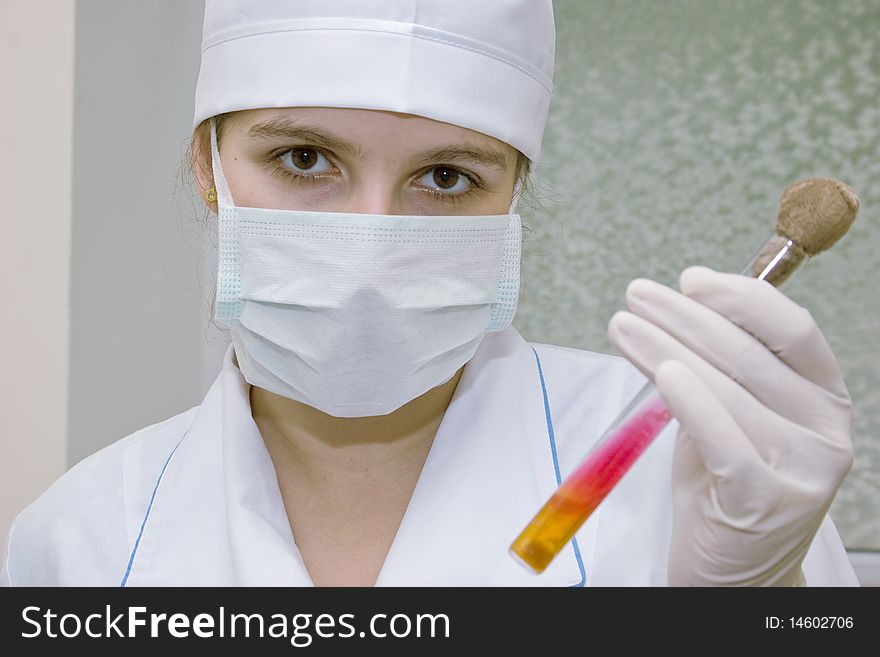 Laboratory worker with a test probe. Laboratory worker with a test probe
