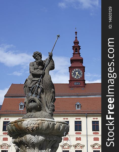 The Jihlava square view represented by the statue of Neptun in the forefront and the tower with the clock in the background. The Jihlava square view represented by the statue of Neptun in the forefront and the tower with the clock in the background.