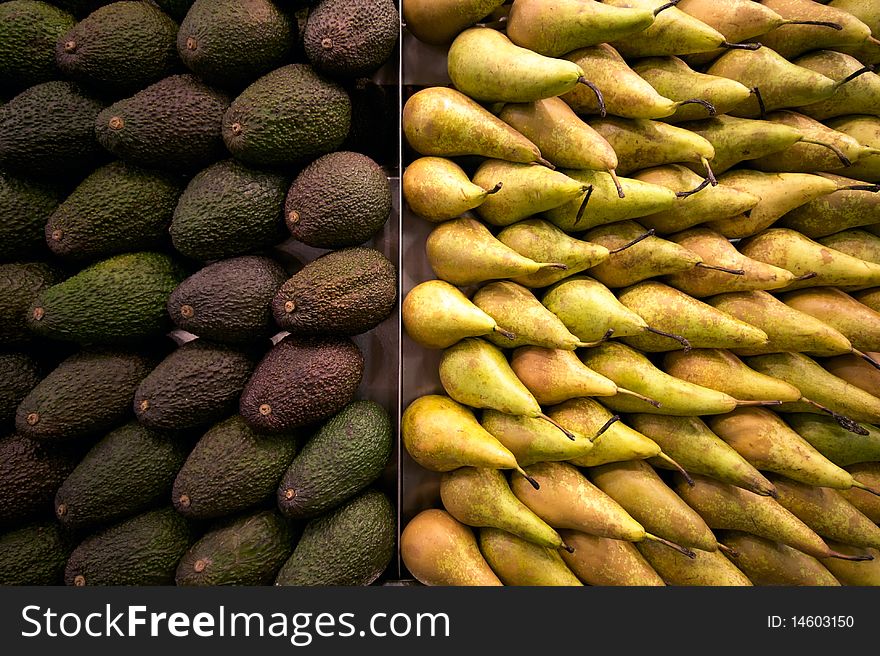 Containers with avocados and pears