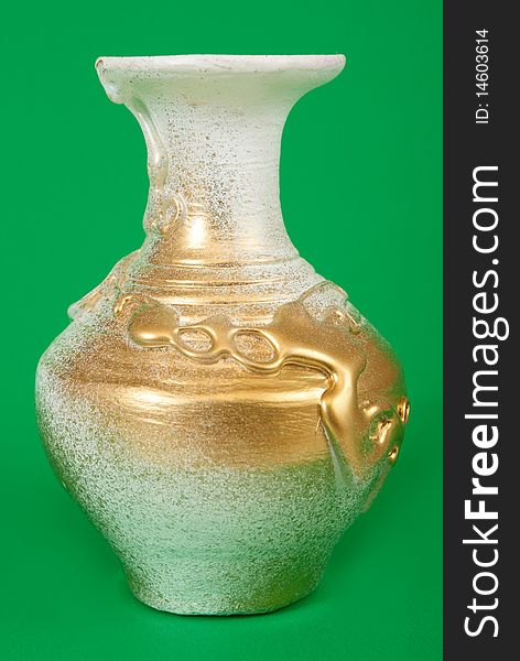 Decorative vase on green background