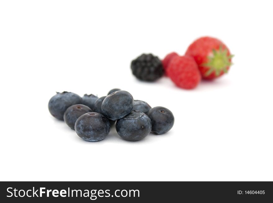 Blueberries and other fruit isolated on a white background. Blueberries and other fruit isolated on a white background