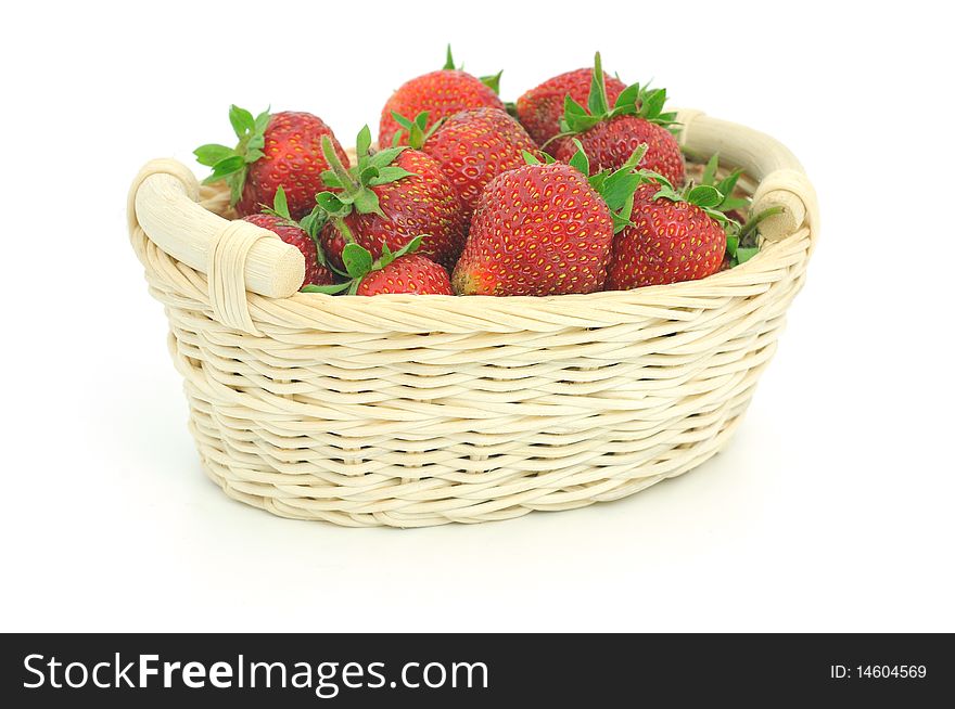 Wooden basket full of fresh strawberries isolated on white background. Wooden basket full of fresh strawberries isolated on white background