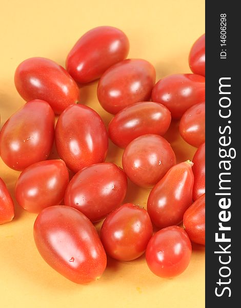 A small group of bright-colored tomatoes. A small group of bright-colored tomatoes