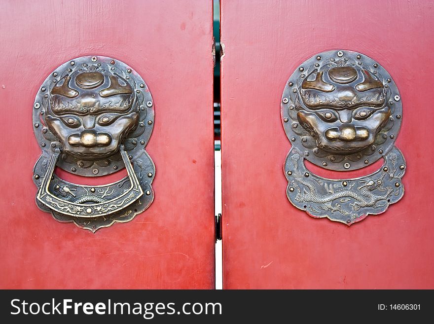 Red door in hutong area, close to Forbidden City, Beijing, China