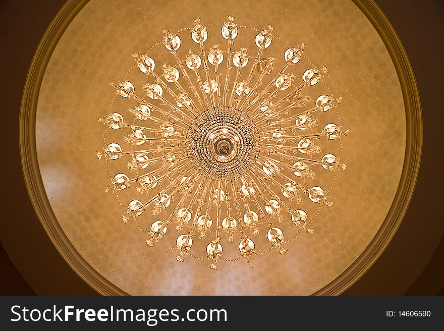 Looking up at a chandelier from below