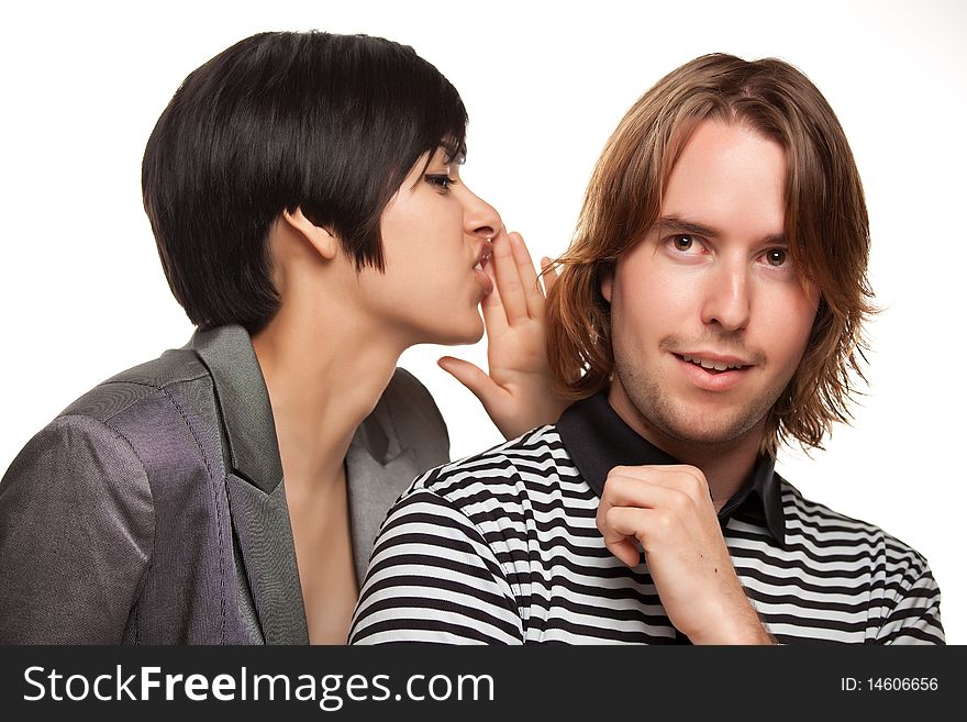 Attractive Diverse Couple Whispering Secrets Isolated on a White Background.