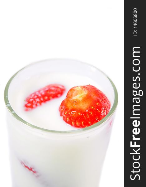 Red strawberries in a glass with milk. Red strawberries in a glass with milk