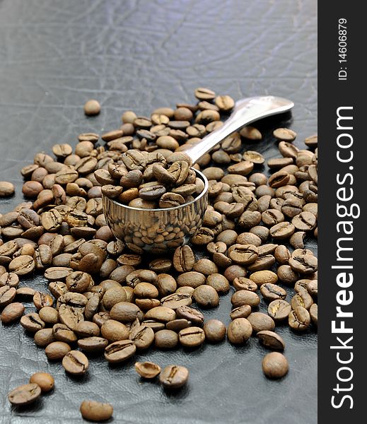 Coffee beans and coffee spoon. Coffee beans and coffee spoon