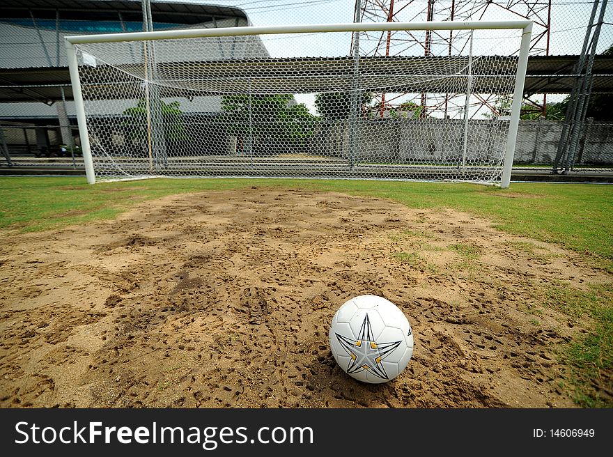 Football in sand and garden. Football in sand and garden