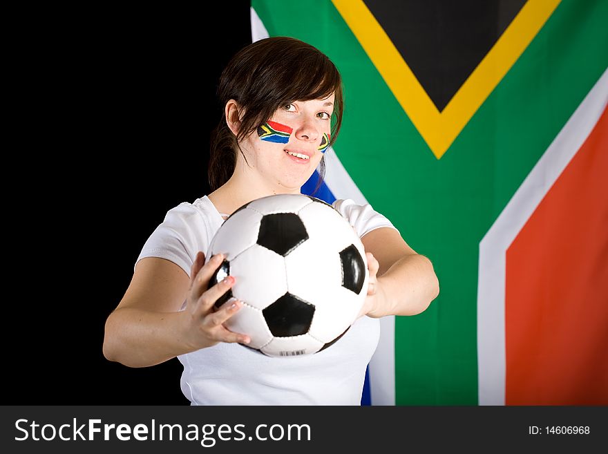 South africa world cup supporter, young female with flags on her cheeks and big south africa flag as background, studio shoot. South africa world cup supporter, young female with flags on her cheeks and big south africa flag as background, studio shoot