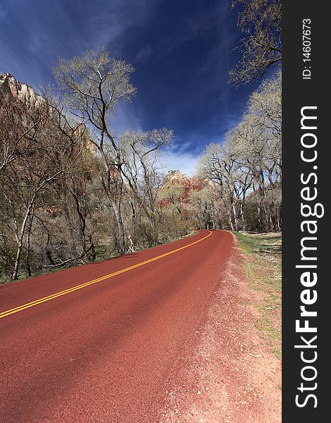 Beautiful red road with double yellow lines in zion national park.Utah