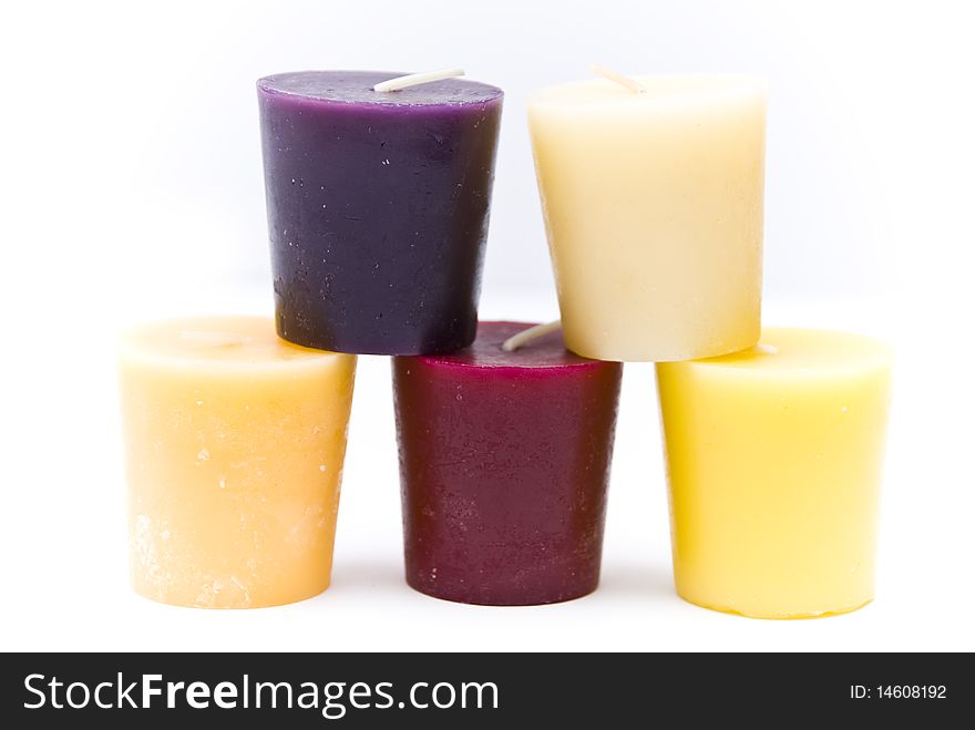 Pyramid of the five colored candles on a white background. Pyramid of the five colored candles on a white background