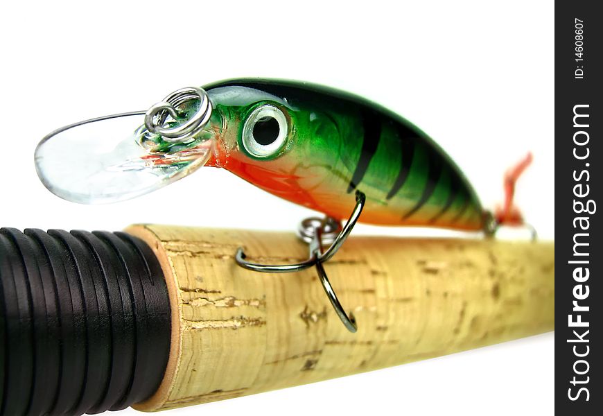 Fishing bait - wobbler on the handle spinning. Soft focus. Fishing bait - wobbler on the handle spinning. Soft focus.