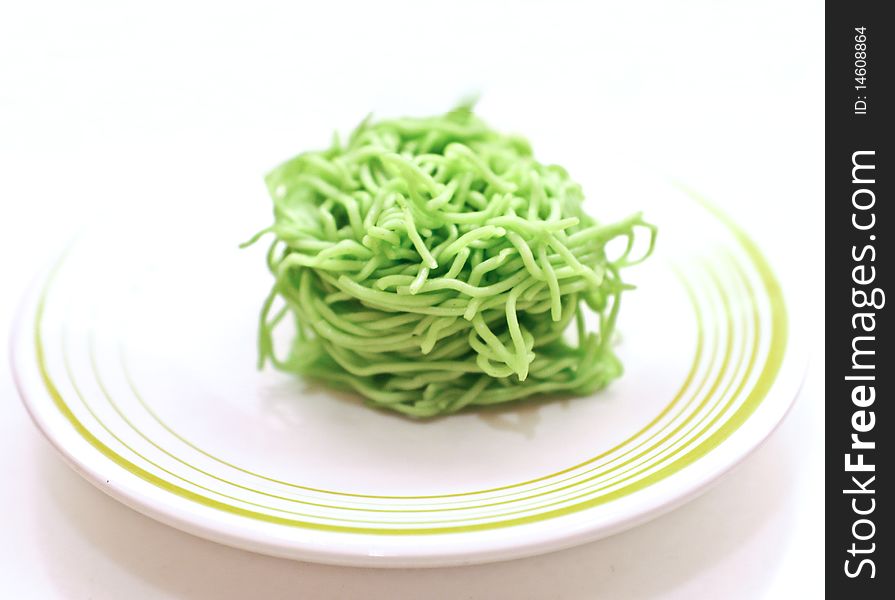 Egg noodles photograph on white dish in the morning