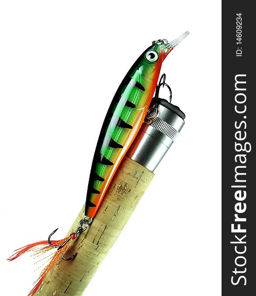 Fishing bait - wobbler on the handle spinning on an isolated white background. Fishing bait - wobbler on the handle spinning on an isolated white background