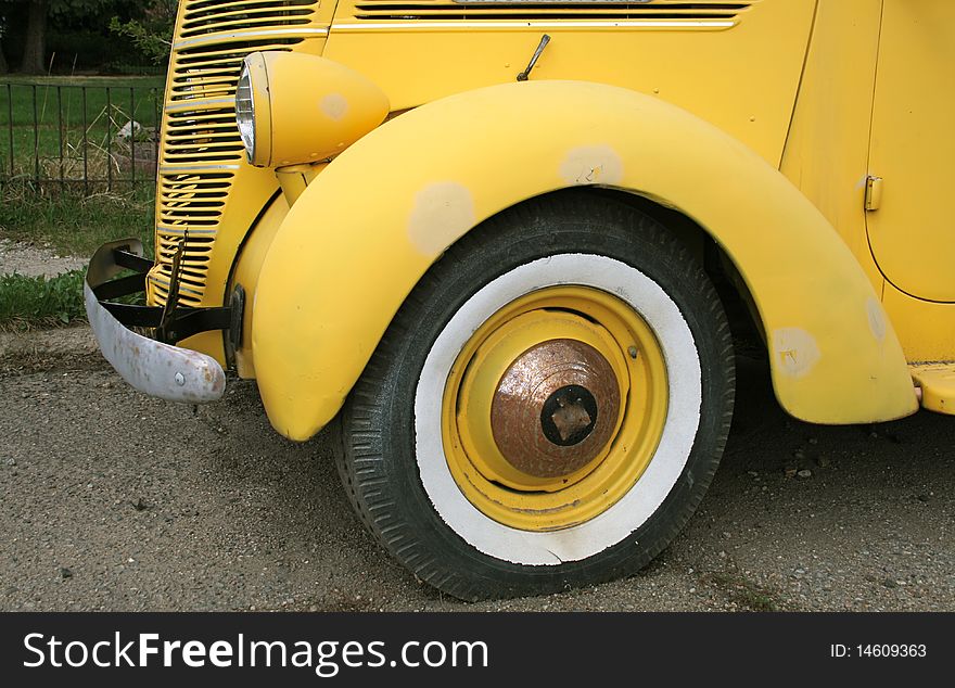 Classic old yellow sedan