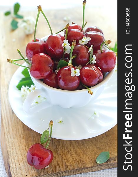 Beautiful  fresh cherry in a white cup.