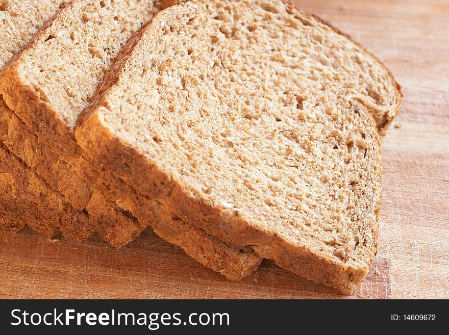 Slices of tasty healthy wholewheat bread on the table