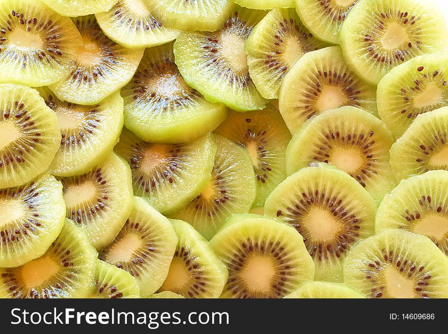 Green sliced kiwi fruit background