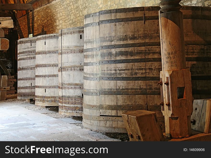 Wine barrels stacked in the cellar, Burgundy, France