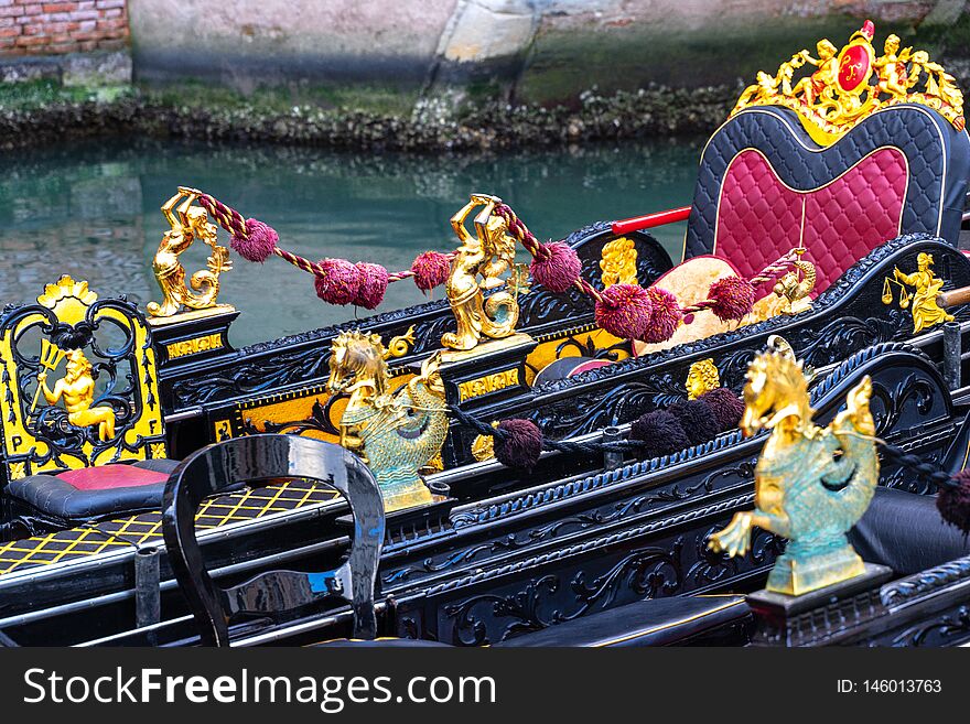 Close up of the interior of traditional venetian boat. It is rich, elegant and finely decorated with fine damask fabric. Venice, italy. Close up of the interior of traditional venetian boat. It is rich, elegant and finely decorated with fine damask fabric. Venice, italy