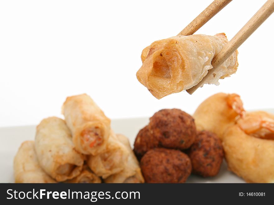Isolated spring roll with chopsticks