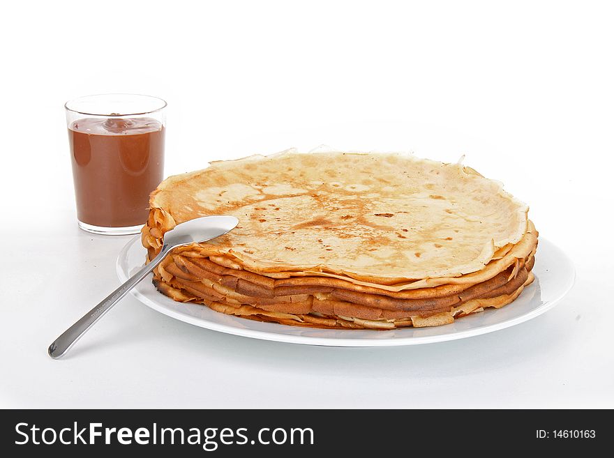 Pancakes with chocolate on white background