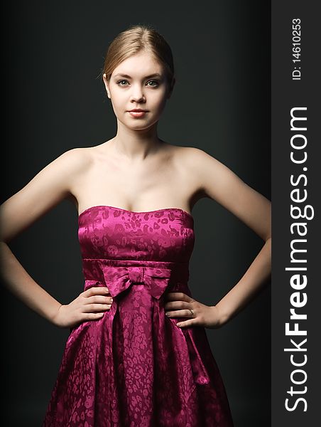 Attractive young woman wearing pink dress