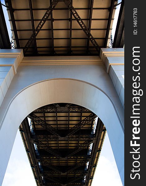 Lower view of a concrete archway supporting large freeway. Lower view of a concrete archway supporting large freeway