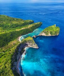Aerial View At Sea And Rocks. Turquoise Water Background From Top View. Summer Seascape From Air. Atuh Beach, Nusa Penida, Bali, I Stock Photo