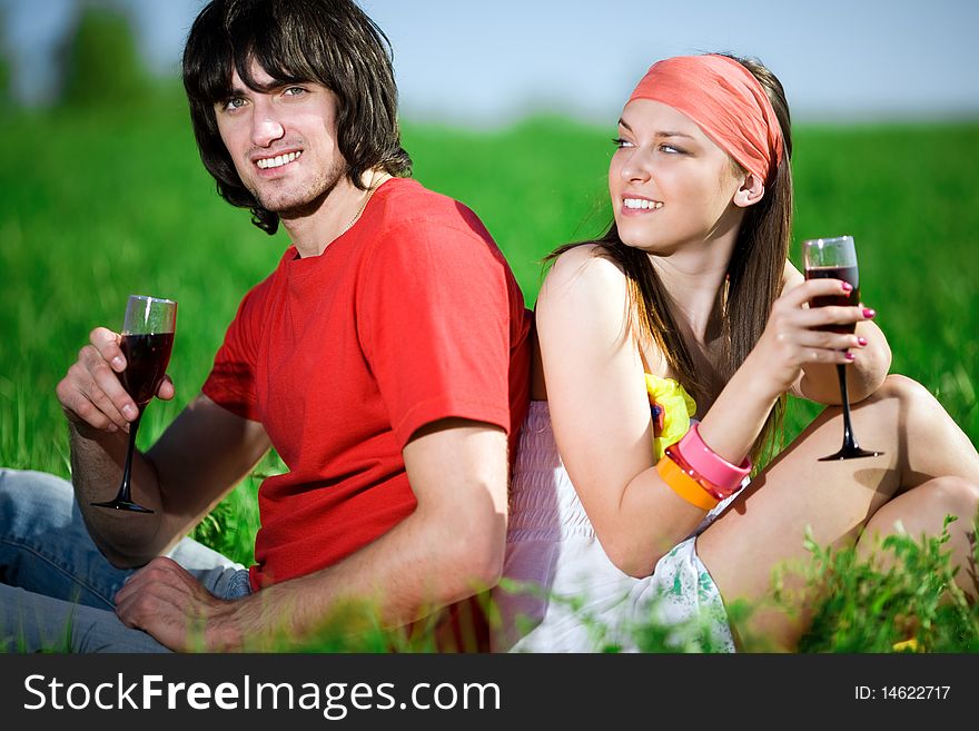 Boy and beautiful girl in kerchief with wineglasses. Boy and beautiful girl in kerchief with wineglasses