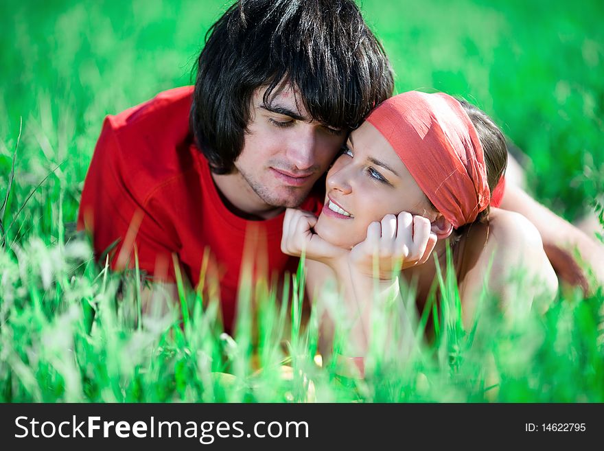 Boy and nice girl with smile on grass. Boy and nice girl with smile on grass