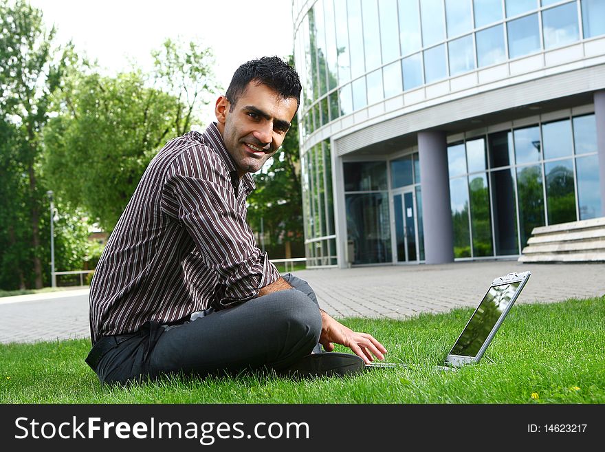 Young and attractive businessman with smile. Young and attractive businessman with smile