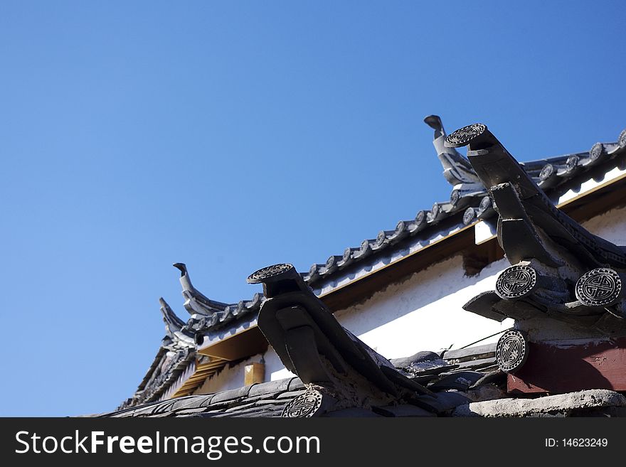 A Chinese roof with many symbols.