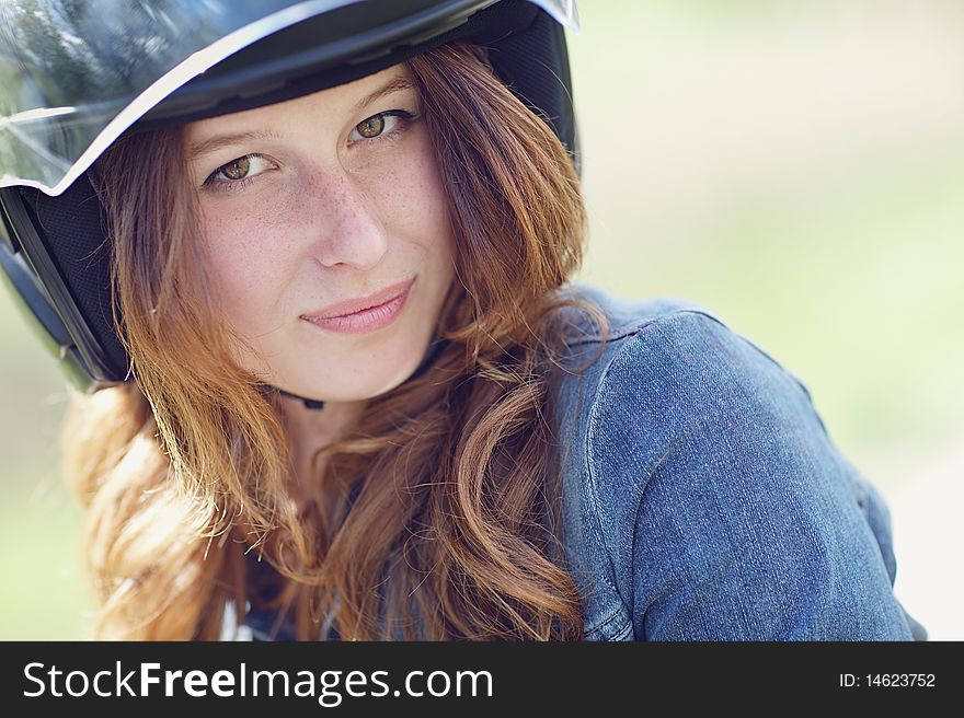 Portrait of a young girl in motorcycle helmet