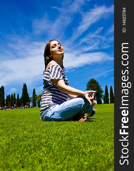 Photo of an beautiful woman on a green field. Photo of an beautiful woman on a green field