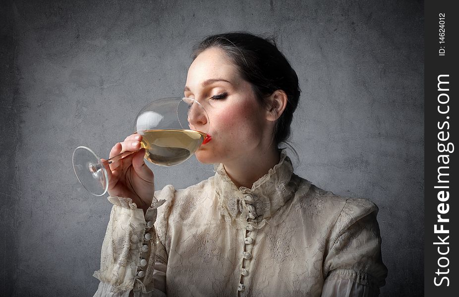 Beautiful woman drinking a glass of wine