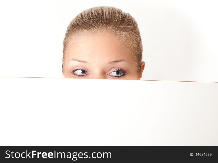 Caucasian blond woman peeping white board. Caucasian blond woman peeping white board