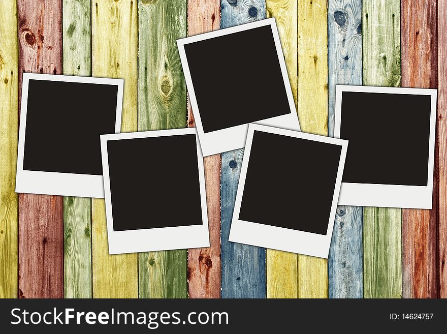 Blank photos on multicolored vintage wooden planks