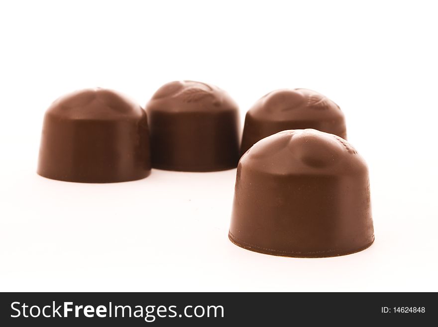 Chocolate candies isolated over white