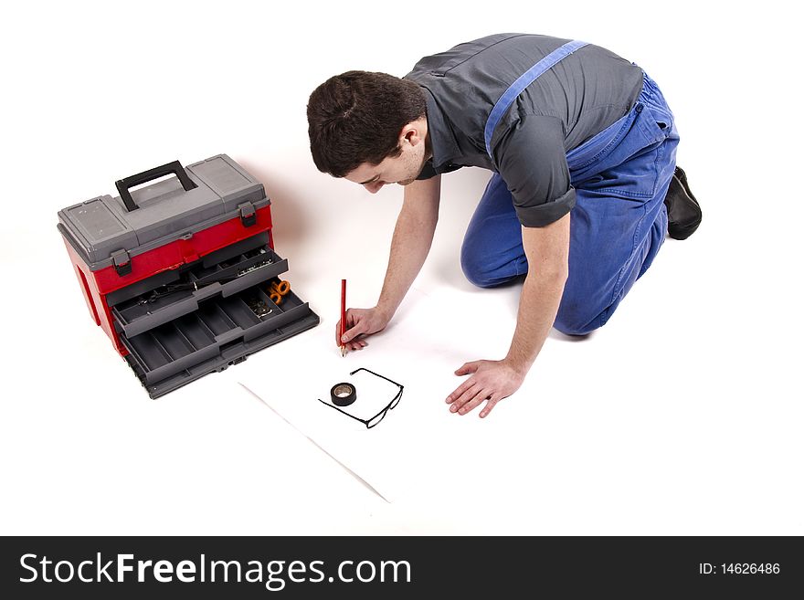 Worker planning his work and toolbox. Worker planning his work and toolbox