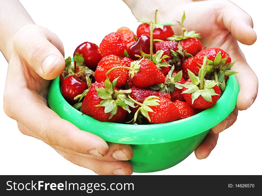 Mans hands keeping plate with a strawberry isolated on white. Mans hands keeping plate with a strawberry isolated on white