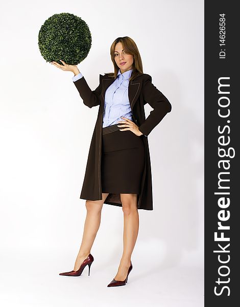 Woman holding a green ball commercial expression